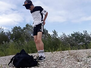 Cute twink Jon Arteen wears dastardly Adidas outfit, shows his underwear, walks freeballing, jerking off throught his short shorts, cumming outdoor