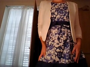 Amateur cross dresser wearing a cute secretary flower dress and sexy white blazer kidding and touching